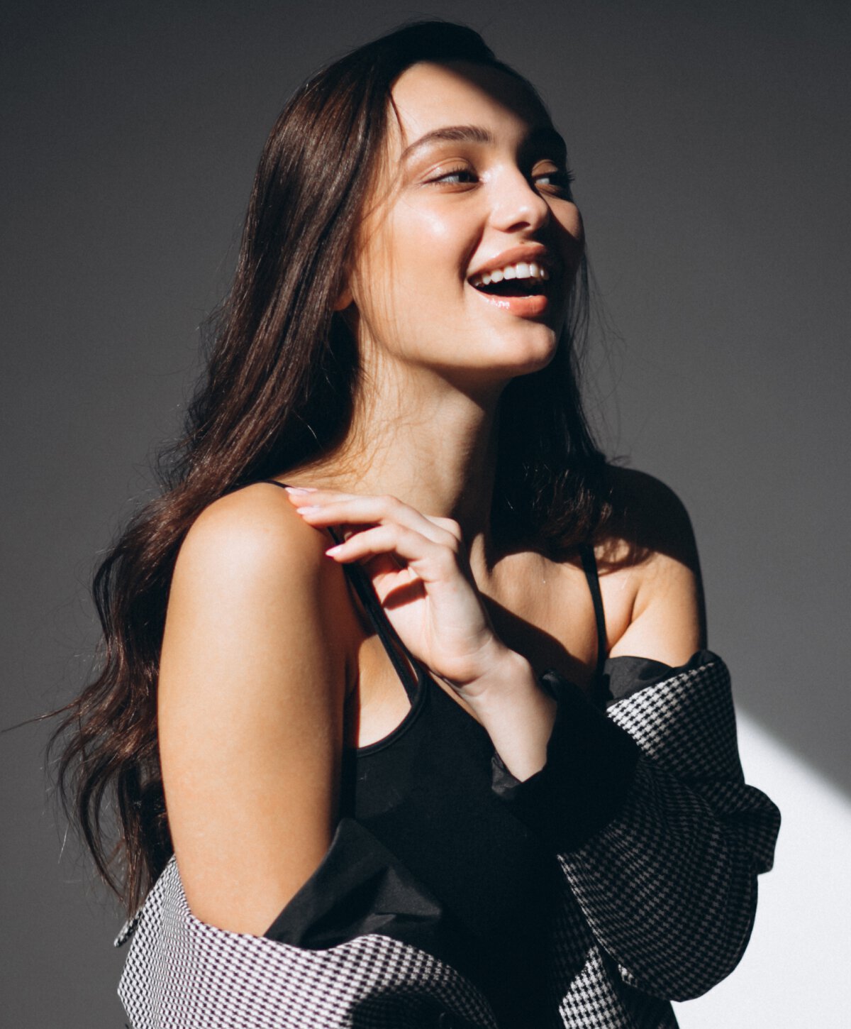 Monmouth County Facials model wearing a black top